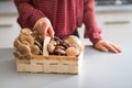 Closeup on housewife with basket with mushrooms