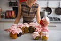 Closeup on housewife checking jars in kitchen Royalty Free Stock Photo