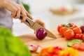 Closeup on housewife cutting red onion Royalty Free Stock Photo
