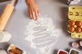 Closeup on housewife drawing christmas tree on kitchen table
