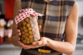 Closeup on housewife showing jar with compote Royalty Free Stock Photo