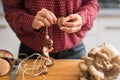 Closeup on housewife stringing mushrooms on string