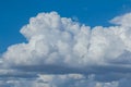 Closeup huge cumulus cloud on a blue sky