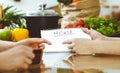 Closeup of human hands discussing something while cooking in kitchen. Women talking about menu. Family dinner