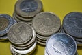 Closeup Hungarian Forint FT HUF coins stacked up in a pile laying on green background