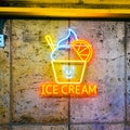 Closeup of an ice cream neon light sign on a wall of a cafe Royalty Free Stock Photo