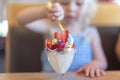 Closeup of ice cream sundae with strawberries and sprinkles Royalty Free Stock Photo