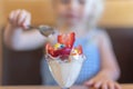 Closeup of ice cream sundae with strawberries and sprinkles Royalty Free Stock Photo