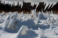 Closeup of icicles covering security fence on a sunny winter Royalty Free Stock Photo