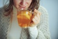 Closeup on ill elegant woman drinking cup of tea Royalty Free Stock Photo