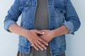 Closeup ill young woman on sofa. concept suffering from abdominal pain