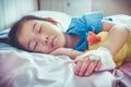 Illness asian child admitted in hospital with saline intravenous