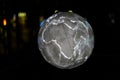 Closeup of an illuminated earth model on black background