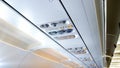 Closeup image of air ventilation holes and individual lights over the passenger seat in aircraft Royalty Free Stock Photo