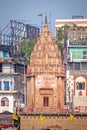 Closeup image of Ancient temple on Prayag ghat on banks of holy river Ganges at colorful ghats of Varanasi Royalty Free Stock Photo