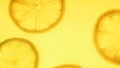 Closeup image of backlit orange slices in juice