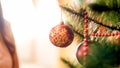 Closeup image of beautiful red bauble hanging on Christmas tree branch Royalty Free Stock Photo