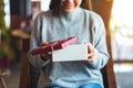 A beautiful young woman opening a gift box Royalty Free Stock Photo