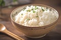 Closeup image of a bowl with freshly cooked rice on display