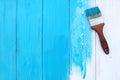 Closeup image of bumpy wooden tabletop painted blue