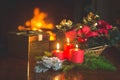 Closeup image of burning candles, Christmas wreath and golden gi Royalty Free Stock Photo