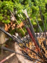 Closeup photo of burning incenses in the buddhist temple garden