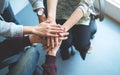 Business team standing and joining their hands together in office Royalty Free Stock Photo