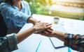 Business team standing and joining their hands together in office Royalty Free Stock Photo