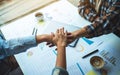 Business team standing and joining their hands together in office Royalty Free Stock Photo