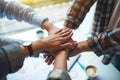 Business team standing and joining their hands together in office Royalty Free Stock Photo