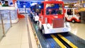 Closeup image of colorful electric cars on the carousel in amusement park at shopping mall