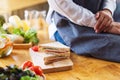 A female chef cooking whole wheat sandwich in kitchen Royalty Free Stock Photo
