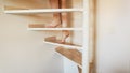 Closeup image of female feet walking up wooden stairs at house Royalty Free Stock Photo