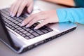 Closeup image of female hands typing on laptop Royalty Free Stock Photo
