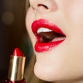 Closeup image on glamor charming beautiful girl lips & white teeth with gorgeous makeup draws red lipstic Royalty Free Stock Photo