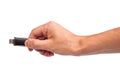 Closeup image: hand holding black USB data storage or connecting computer device with USB cable Royalty Free Stock Photo