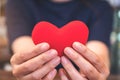 Hands holding a red heart sign Royalty Free Stock Photo