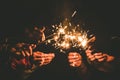 Hands holding sparklers for celebrate in the night time Royalty Free Stock Photo