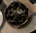 Closeup image of a pot of moules marinieres mussels served in a restaurant Royalty Free Stock Photo