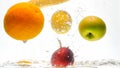 Closeup image of lots of tasty fresh juicy fruits falling in water and splashing