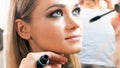 Closeup image of makeup artist applying mascara with brush Royalty Free Stock Photo