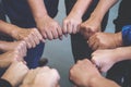 Many people hands holding a jigsaw puzzle in circle together Royalty Free Stock Photo