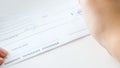 Closeup image of person signing personal bank cheque Royalty Free Stock Photo
