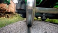 Closeup image of polished metal surface of cargo train wagon on railway Royalty Free Stock Photo