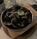 Closeup image of a pot of moules marinieres mussels served in a restaurant Royalty Free Stock Photo