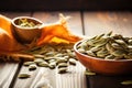 closeup image of raw pumpkin seeds on a wooden table Royalty Free Stock Photo