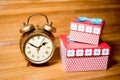 Closeup image of set of alarm clock and gift boxes Royalty Free Stock Photo