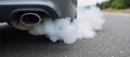 Closeup image showing car emissions clouding the air as an example of vehiclerelated air pollution Royalty Free Stock Photo