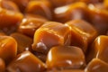 Closeup image of soft caramel candies with a glossy, tempting surface