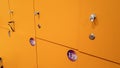 CLoseup image of straight long rows of yellow lockers in the school or college Royalty Free Stock Photo